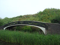 Typical cast iron bridge over closed arm on the BCN Old Main Line